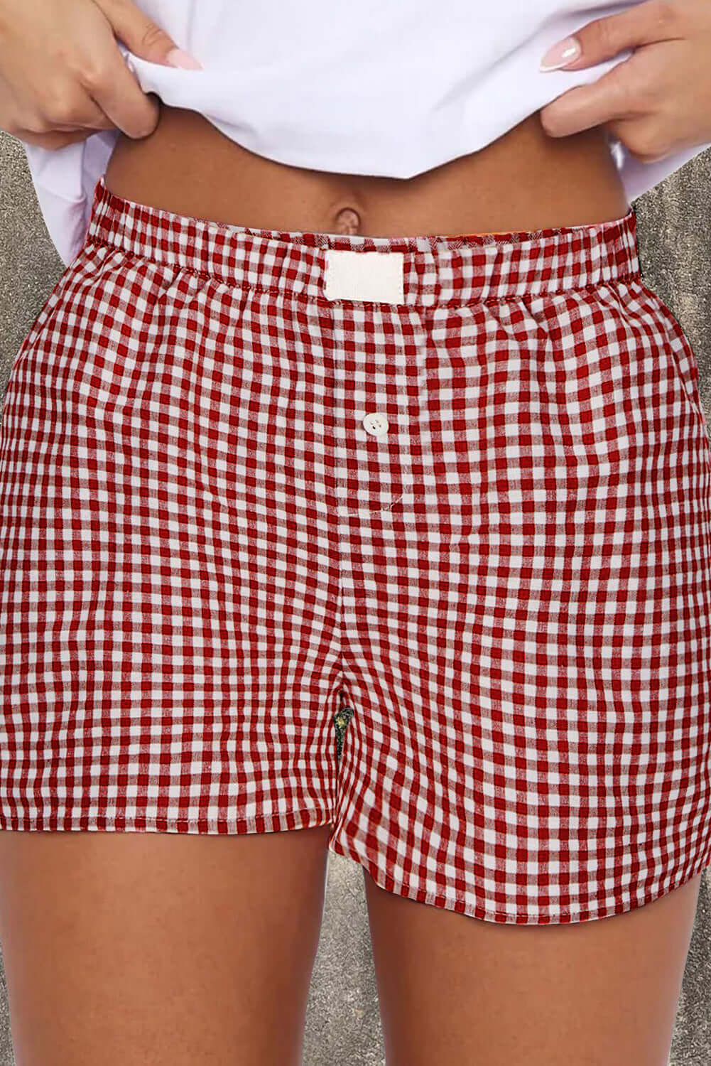 Red gingham high waist shorts with elastic waistband, perfect for summer picnics and outdoor activities.