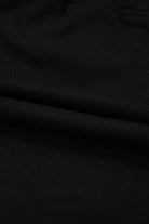 Close-up of soft black French terry fabric for the Skort Story mini skort, showcasing its cozy texture.