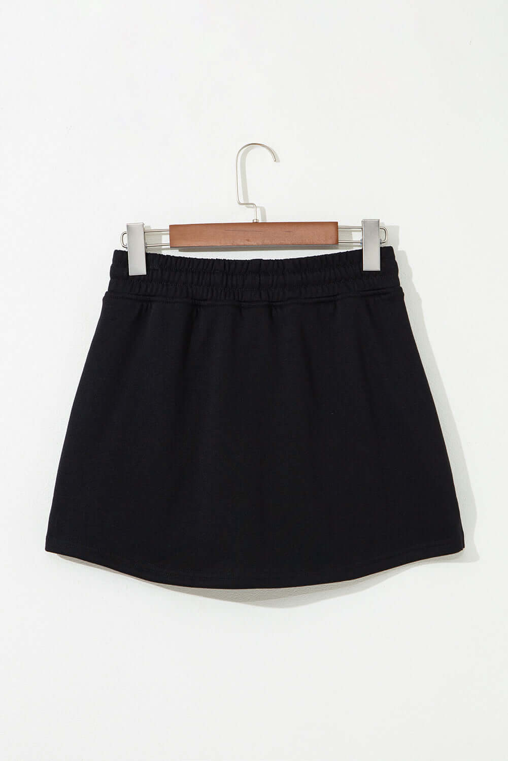 Black French terry drawstring skort, perfect blend of comfort and style for casual wear.