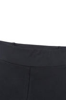 High-waisted black leggings with tummy control and crisscross detail, perfect for gym and daily wear.