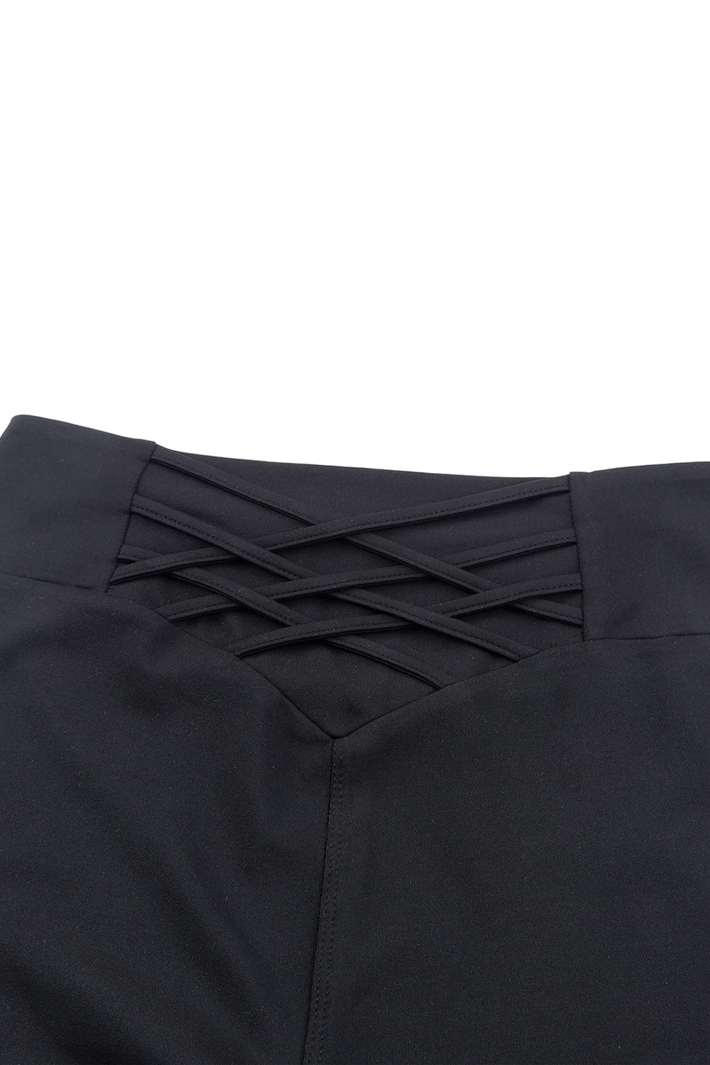 Close-up of the high-waisted Crossed Paths Leggings showing trendy crisscross detail for flattering fit.