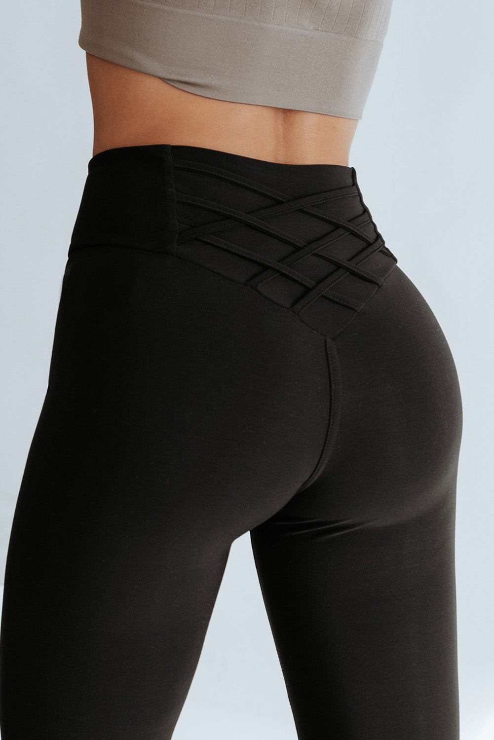 High-waisted Crossed Paths leggings with trendy crisscross detail, offering comfort and a flattering fit.