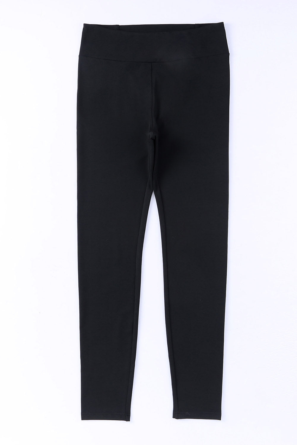 High-waisted black leggings with crisscross detail for gym and daily wear, offering comfort, tummy control, and stylish fit.