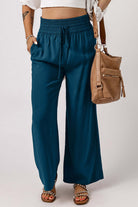 Cute & Comfy COASTAL NIGHTS PANTS - Teal Tiger Boutique by Vivian-Lu $32.00 Discover trendy, teal blue COASTAL NIGHTS PANTS by Teal Tiger Boutique. Enjoy comfort with a pull-on design, smocked waist, and side pockets. Teal Tiger Boutique