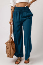 Cute & Comfy COASTAL NIGHTS PANTS - Teal Tiger Boutique by Vivian-Lu $32.00 Discover trendy, teal blue COASTAL NIGHTS PANTS by Teal Tiger Boutique. Enjoy comfort with a pull-on design, smocked waist, and side pockets. Teal Tiger Boutique