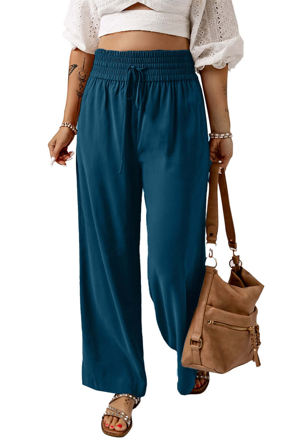 Cute & Comfy COASTAL NIGHTS PANTS - Teal Tiger Boutique by Vivian-Lu $32.00 Discover trendy, teal blue COASTAL NIGHTS PANTS by Teal Tiger Boutique. Enjoy comfort with a pull-on design, smocked waist, and side pockets. Teal Tiger Boutique