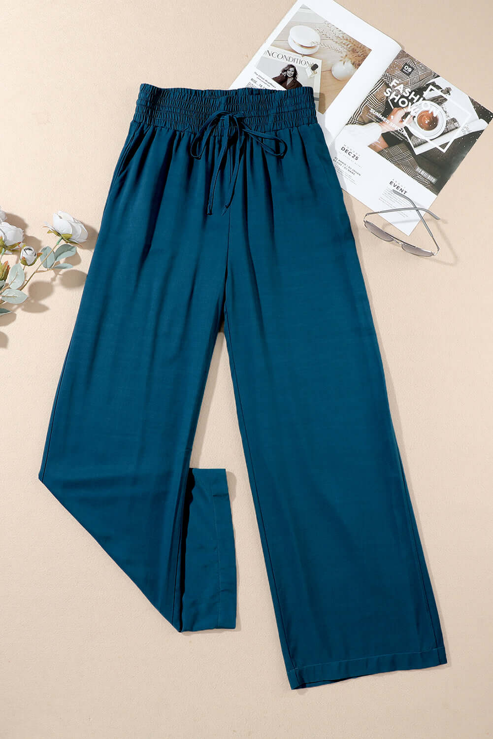 Cute & Comfy COASTAL NIGHTS PANTS - Teal Tiger Boutique by Vivian-Lu $32.00 Discover trendy, teal blue COASTAL NIGHTS PANTS by Teal Tiger Boutique. Enjoy comfort with a pull-on design, smocked waist, and side pockets. Teal Tiger Boutique