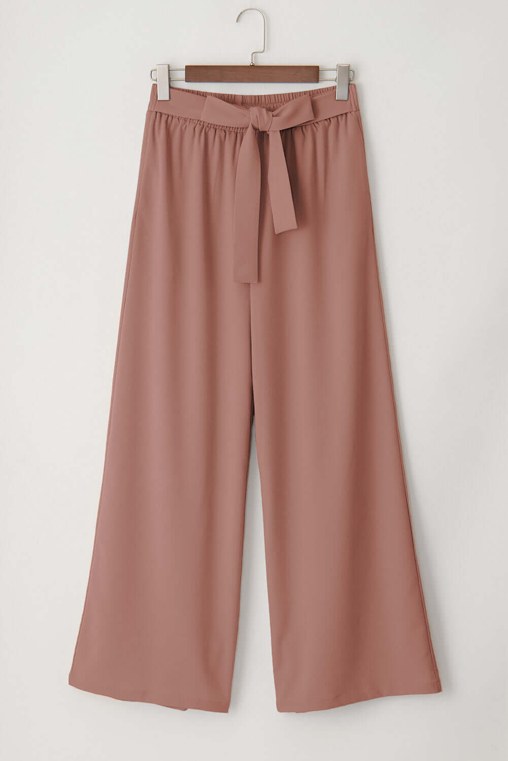 Flowy cocoa wide-leg pants with tie-front sash and side pockets for effortless style.