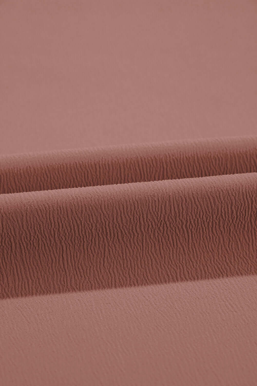 Close-up of soft cocoa fabric texture for City Sway Wide Leg Pants, showcasing its flowy, breathable quality.