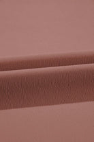 Close-up of soft cocoa fabric texture for City Sway Wide Leg Pants, showcasing its flowy, breathable quality.