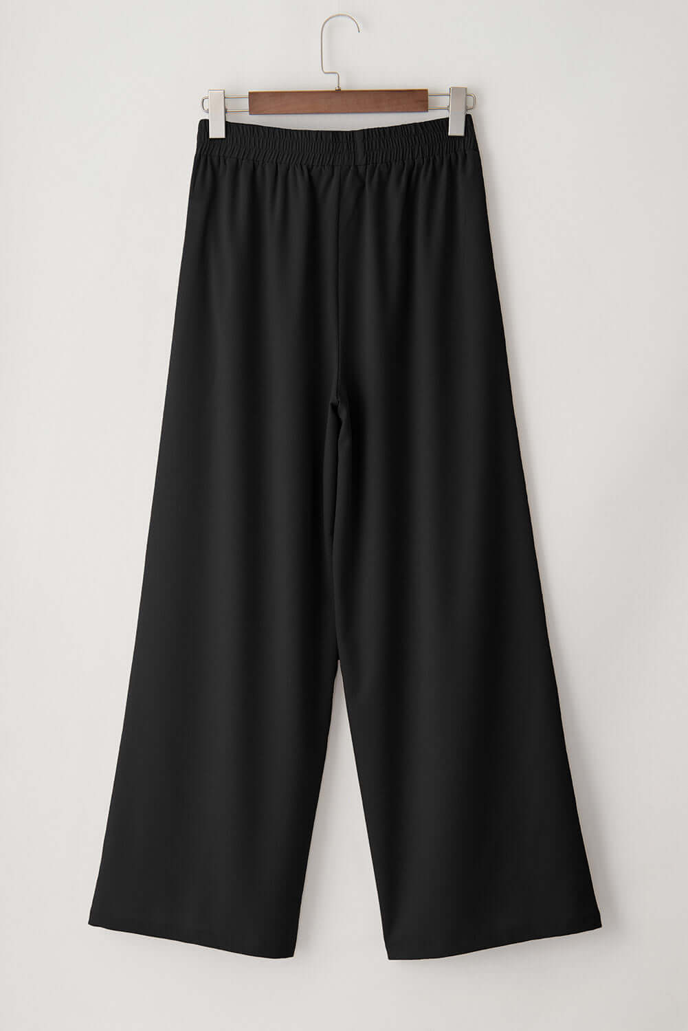 CITY SWAY Wide Leg Pants in black, featuring a high-waisted design and relaxed fit, perfect for work-to-weekend style.