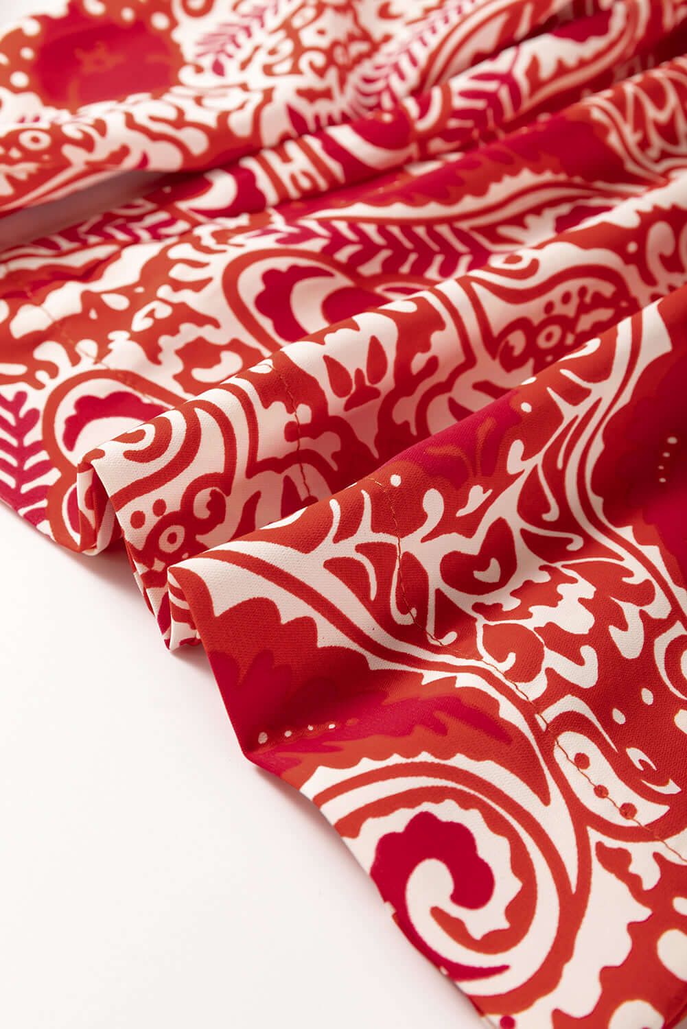 Red and cream abstract fabric, showcasing a boho glam pattern perfect for wide leg pants.