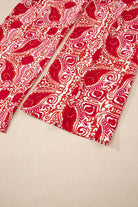 Boho Glam Wide Leg Pants in red and cream abstract motif, featuring a stylish high waist design and button detailing.