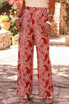 Chic red and cream boho glam wide leg pants with abstract motif and high waist design.