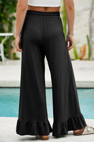 Charmed Comfort Wide Leg Pants in black with ruffled hem, perfect for stylish and comfortable all-day wear.