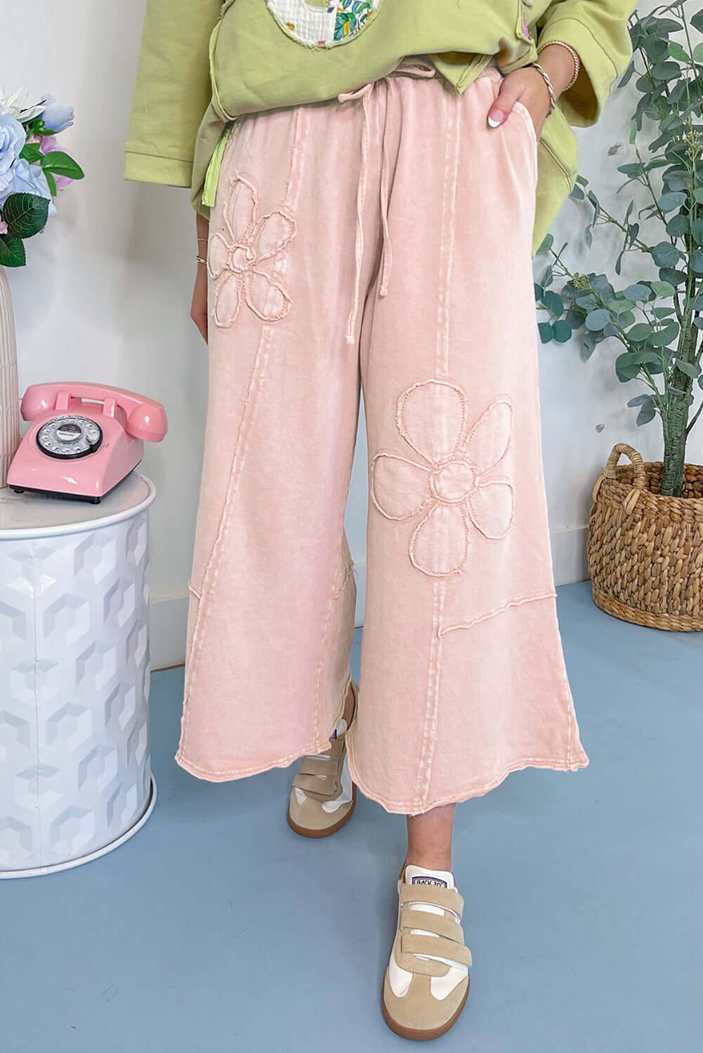 Pink flower patch cropped wide leg pants in soft terry knit for a boho-chic look and all-day comfort.