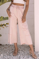 Daisy Daydreamer Pants in pink with flower patches, cropped wide leg design, perfect for boho-chic style and comfort.