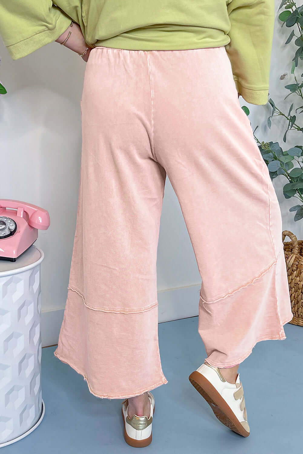 Daisy Daydreamer cropped wide leg pants in soft pink, showcasing flower patches and a comfortable terry knit fabric.