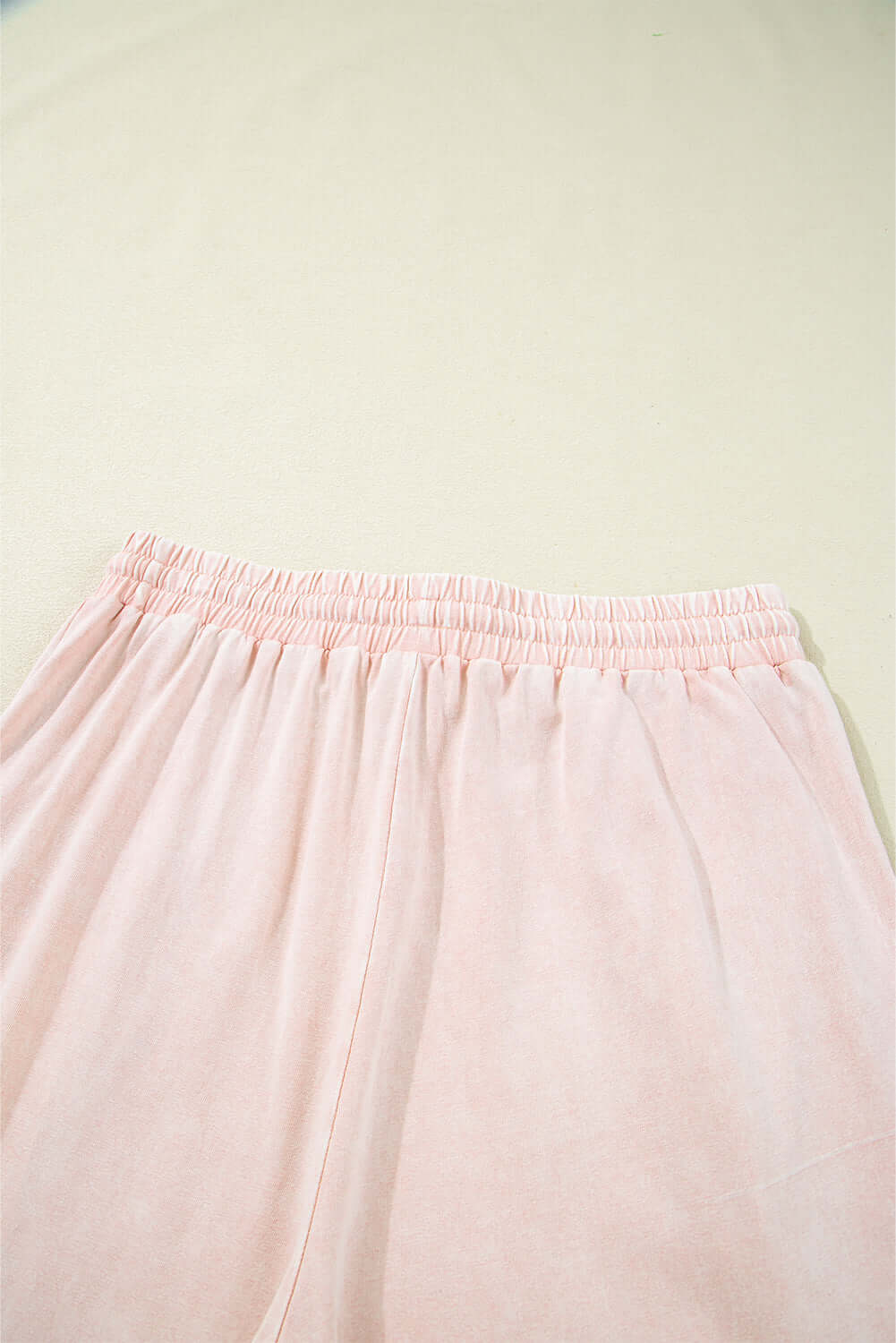 Daisy Daydreamer cropped wide leg pants in soft pink terry knit fabric, featuring an elastic waistband.