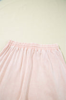 Daisy Daydreamer cropped wide leg pants in soft pink terry knit fabric, featuring an elastic waistband.