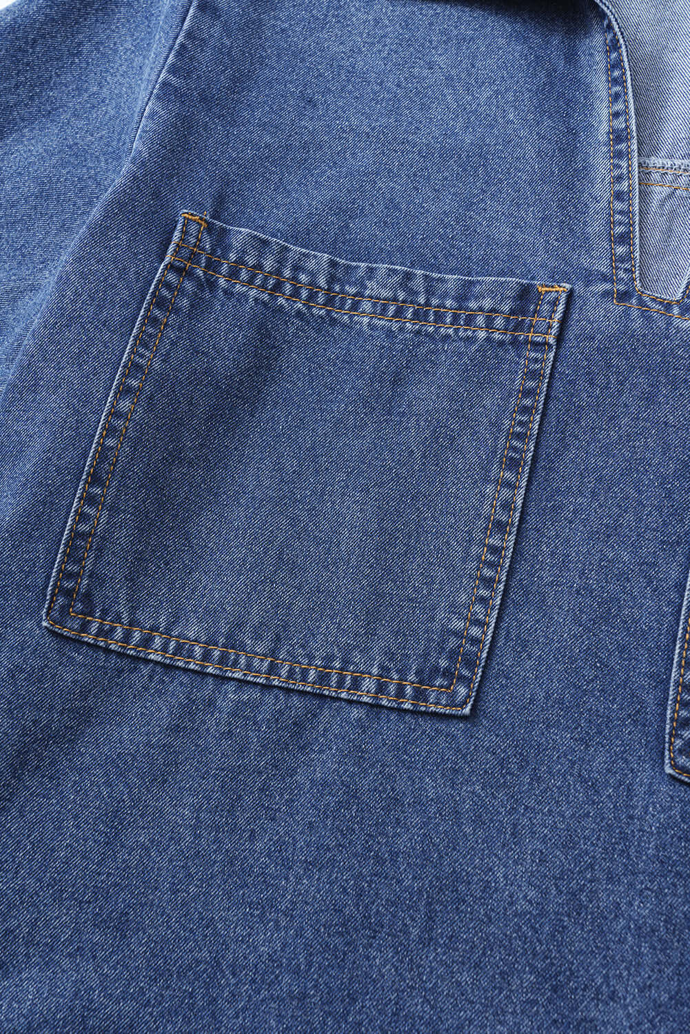 Close-up of the Blue Jean Breeze Dress's oversized patched chest pocket in soft denim fabric.