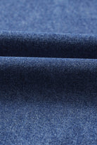 Close-up of soft denim fabric texture for Blue Jean Breeze Dress, showcasing its quality and color.
