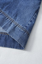 Detail of the hemline of the Blue Jean Breeze Dress showcasing denim fabric and stitching.