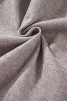 Close-up of taupe fabric texture of the LOOKING FORWARD Jacket, showcasing 85% polyester and 15% viscose material blend.