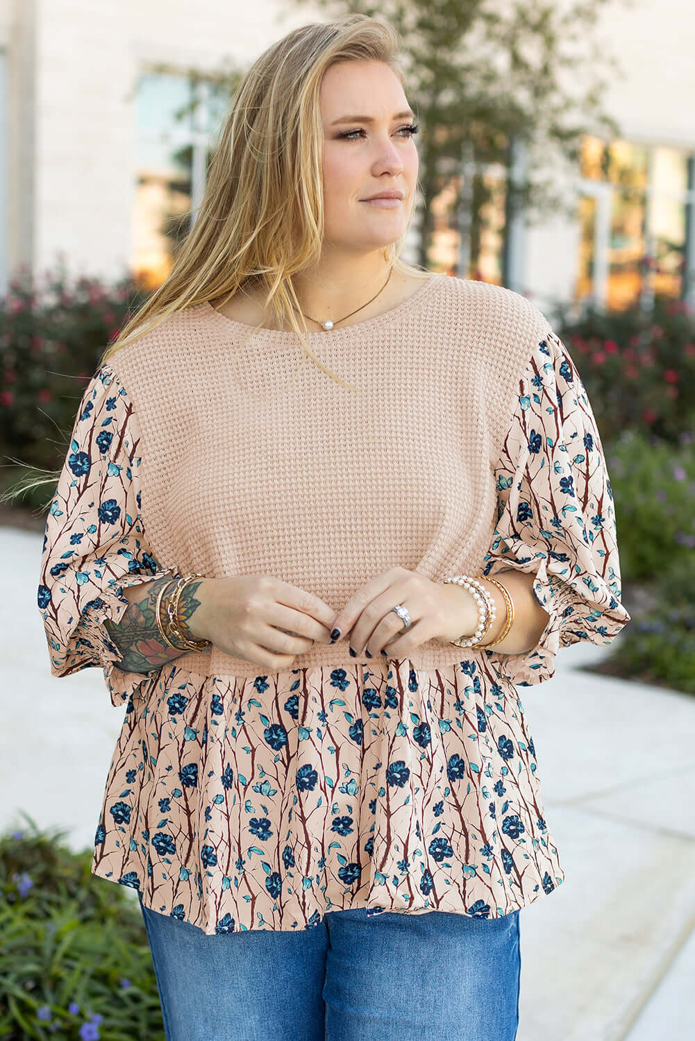 Plus size SLIP AWAY top featuring floral print, flounce sleeves, and knit patchwork for a stylish look. Perfect for any occasion.