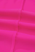 Close-up of hot pink fabric with detailed seaming, showcasing the vibrant color and texture of the Berry Brilliance Top.