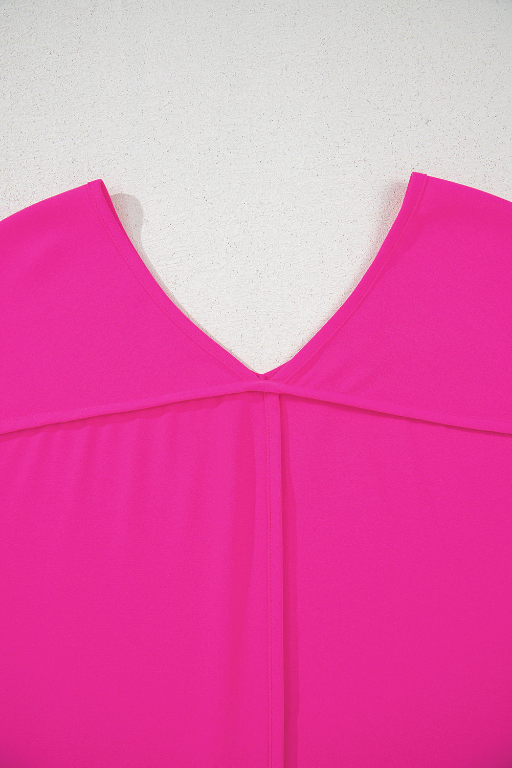 Berry Brilliance hot pink V-neck top with seamed back detail and relaxed fit.