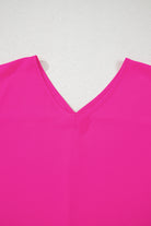 Hot pink plus size V-neck top showcasing stylish neckline and vibrant color for trendy looks.