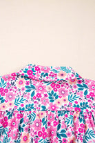 Back view of the Heirloom Blooms Dress featuring a vibrant pink floral print and delicate collar.