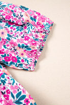 Detail of the Heirloom Blooms Dress showing vibrant pink floral print and gathered sleeve.