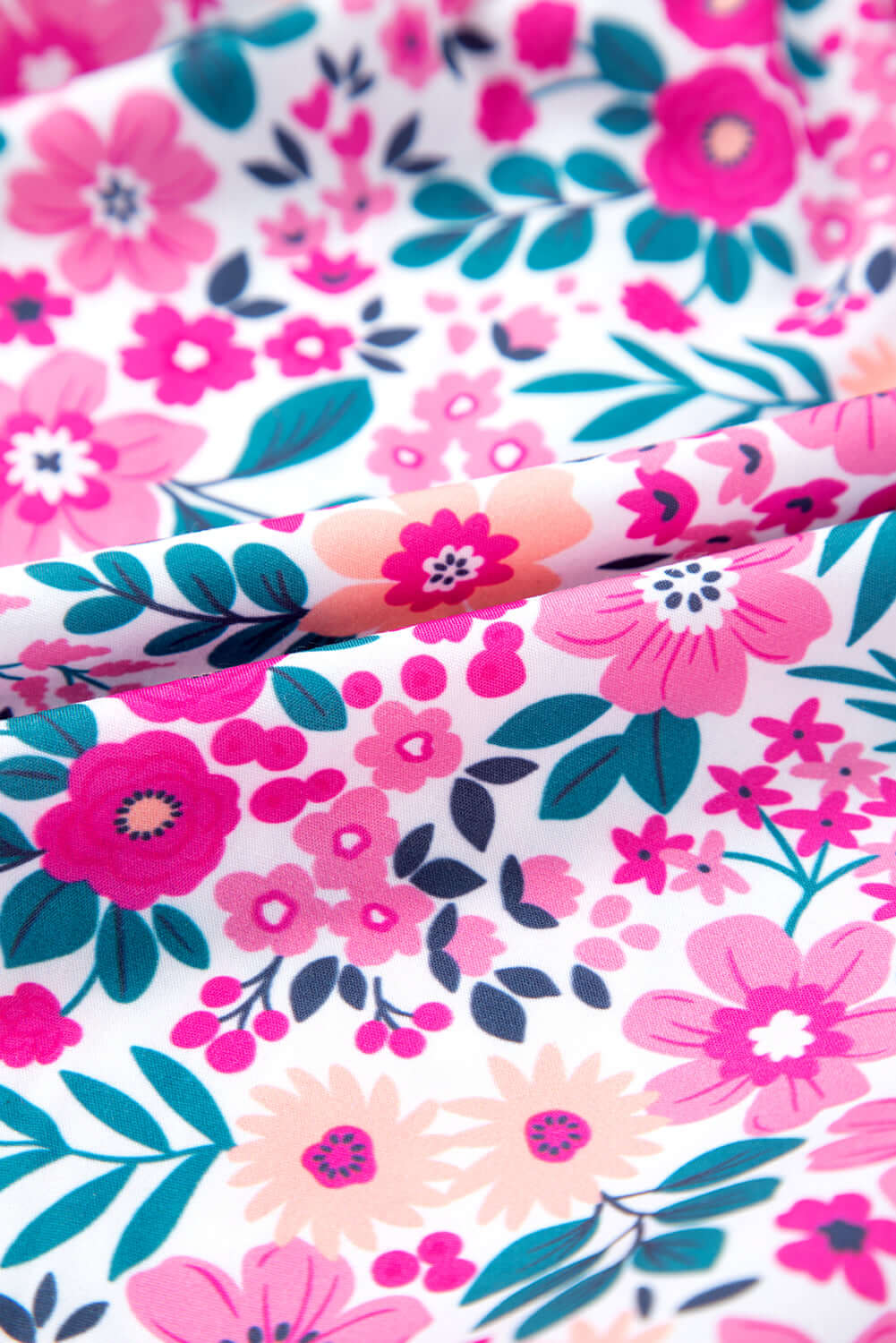 Close-up of vibrant pink floral fabric, perfect for spring and summer apparel like the Heirloom Blooms Dress.