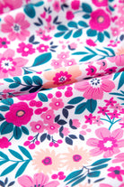 Close-up of vibrant pink floral fabric, perfect for spring and summer apparel like the Heirloom Blooms Dress.