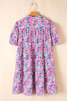 Heirloom Blooms Dress in vibrant pink floral print, featuring puff sleeves and a tiered skirt.