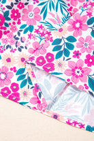 Close-up of vibrant pink floral pattern on fabric of the Heirloom Blooms Dress, showcasing its spring and summer style.