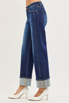 CHARLEIGH JEANS by Risen featuring mid-rise waist and cuffed wide-leg design in dark wash.