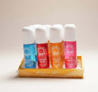 SCENT STORY by Solo En Ibiza body mists in colorful bottles on display.
