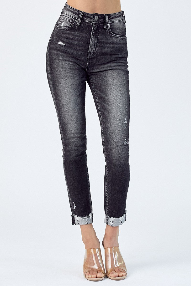 High-rise Kandyce Jeans by Risen in vintage wash with cuffed hem, styled with clear ankle boots.