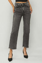 RISEN Veronica Jeans in acid wash black with frayed hem, high rise straight leg fit, styled with black heels.