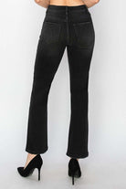 Black straight leg PIPER JEANS by Risen Denim, featuring a high waist and sleek, no-distressing design from the back view.