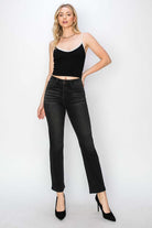 Model showcasing PIPER JEANS by Risen Denim, featuring high waist and straight leg design in jet black, paired with a black top.