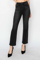 PIPER JEANS by Risen Denim, jet black straight leg jeans with high waist and soft stretchy material, styled with heels.