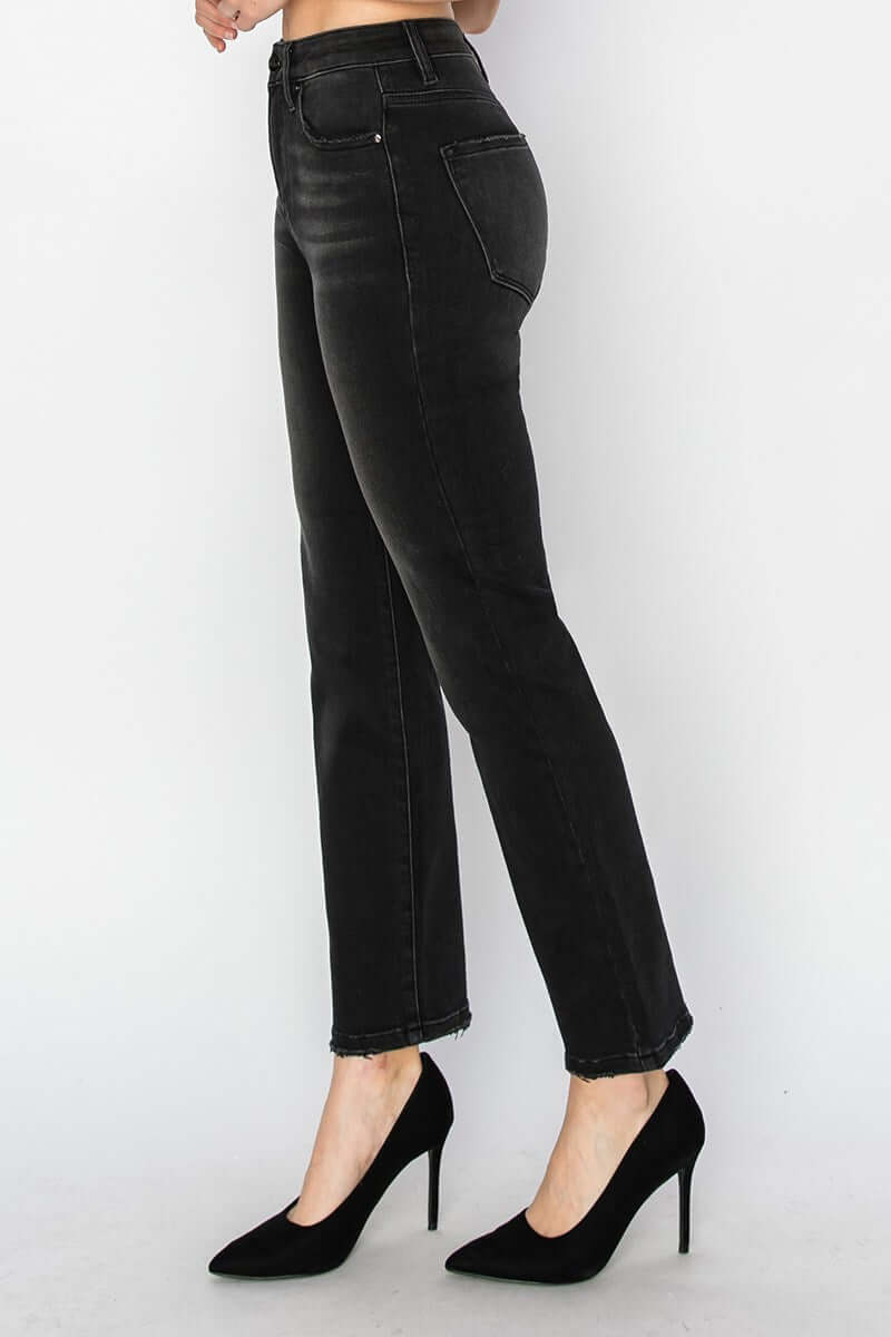 Side view of PIPER JEANS by Risen Denim, jet black straight leg jeans with high waist and no distressing.