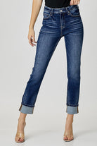 Risen Margot Jeans in dark wash with paint splatter design, showcasing a trendy cuffed style for casual wear.