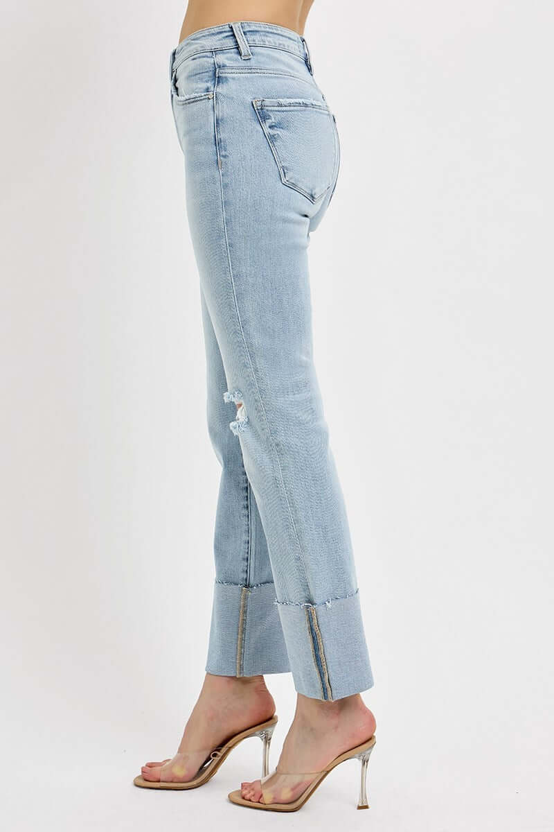 RISEN VANESSA JEANS shown from the side, featuring a high rise design and wide cuffs for a stylish denim look.