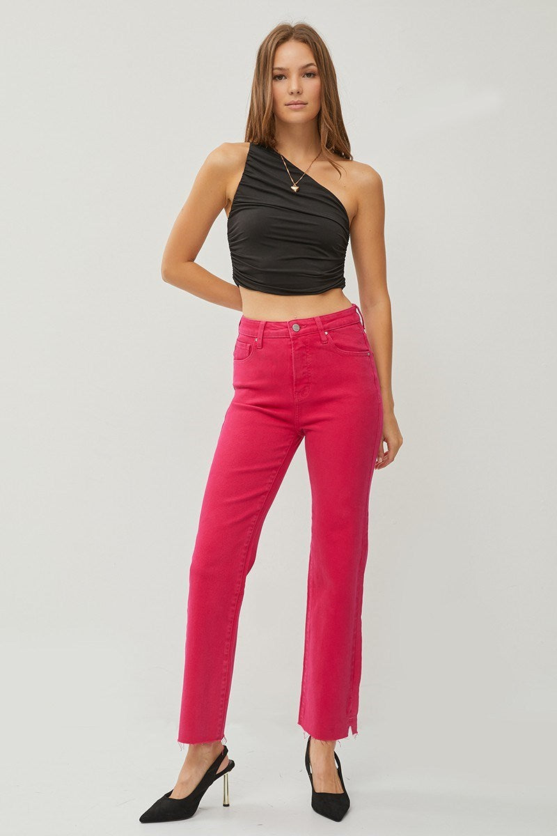 High-rise fuchsia tummy control jeans with slight and straight cut, paired with a black crop top.