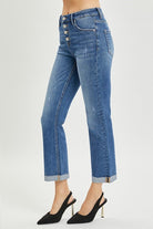 High rise button fly RISEN JOSIE JEANS with straight leg style, paired with black heels, showcasing modern denim fashion.